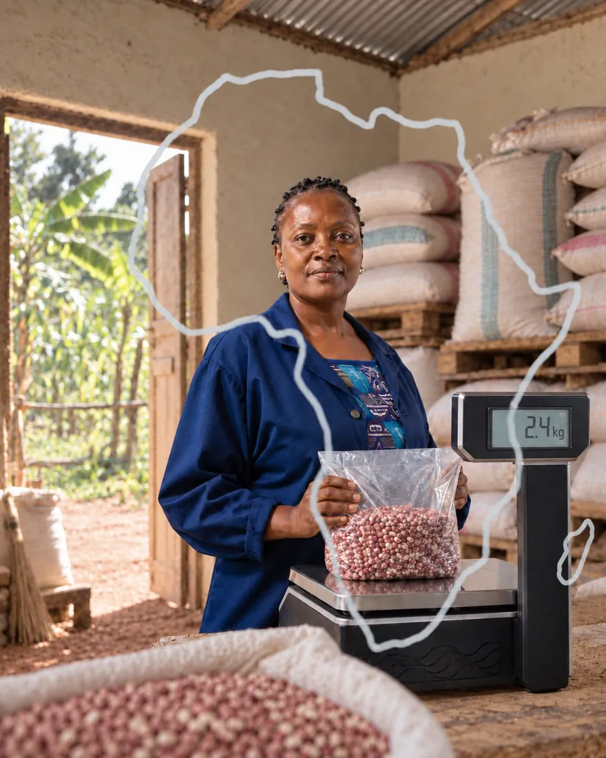 A farmer stands at a scale with a bag of beans, a hand-drawn line of Africa over the image